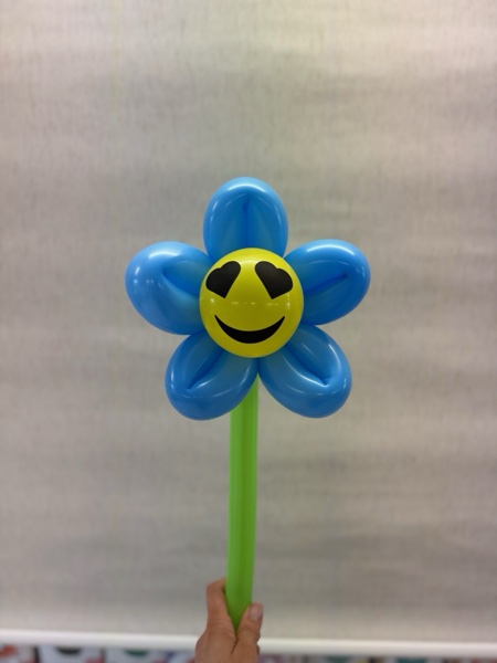 Fröhliche Smiley-Ballonblume